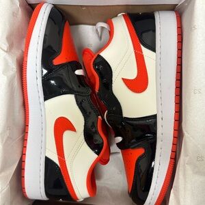 Jordan 1 Low, Team Orange and Black patent, Youth Size 6.5. Womens 8.